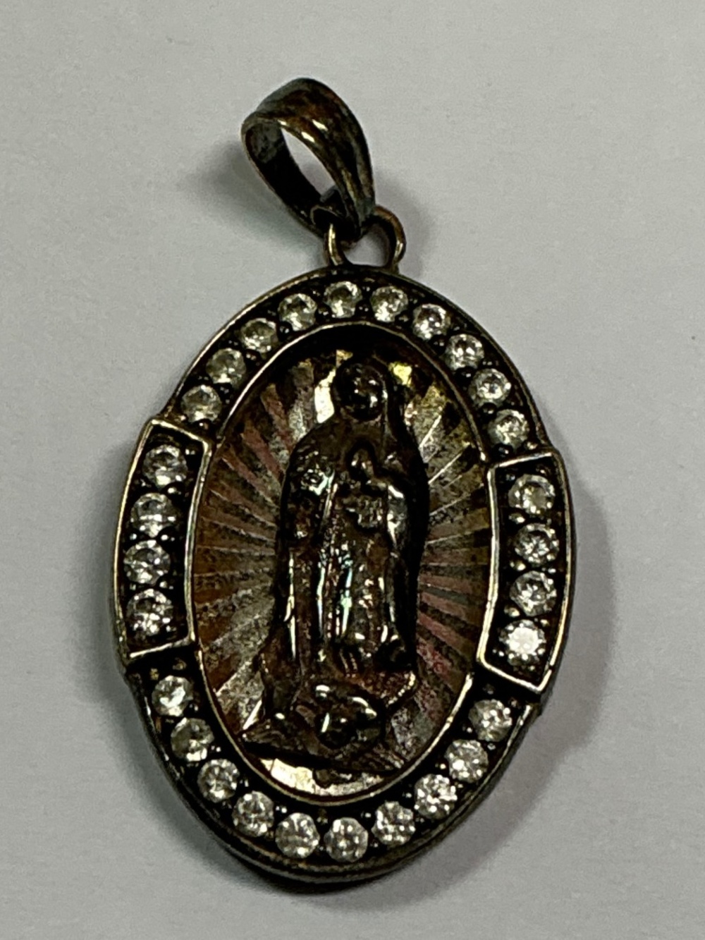 Sterling Silver Our Lady Of Guadalupe Medal Surrounded by Clear stones. 1” long